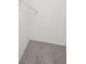 Walk in closet with wire rack storage and neutral carpet at 4001 Avalon Sw Rd, Atlanta, GA 30331