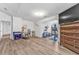 Finished basement area with wood-look floors, and home gym equipment at 6317 Selborn Sw Dr, Atlanta, GA 30331