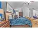 Spacious bedroom with vaulted ceiling, comfortable bed, and sitting area at 6317 Selborn Sw Dr, Atlanta, GA 30331