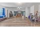 Expansive primary bedroom with wood-look floors, sitting area, and en-suite bathroom at 6317 Selborn Sw Dr, Atlanta, GA 30331