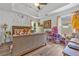 Brightly decorated bedroom featuring hardwood floors, ceiling fan, and tray ceiling at 6317 Selborn Sw Dr, Atlanta, GA 30331
