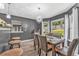 The Dining Room is furnished with a chandelier, chairs, and a bright window at 6317 Selborn Sw Dr, Atlanta, GA 30331