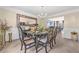 Elegant dining room featuring a chandelier, table with seating for six, and an ornate mirror accenting the space at 6317 Selborn Sw Dr, Atlanta, GA 30331