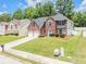 Beautiful brick home with a manicured lawn, driveway, and suburban neighborhood setting, perfect for families at 6317 Selborn Sw Dr, Atlanta, GA 30331