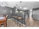 Open floor plan shows kitchen with granite counters and a dining area with barstool seating at 6317 Selborn Sw Dr, Atlanta, GA 30331