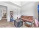 Living room features a brown futon, coffee table, and hardwood flooring at 6317 Selborn Sw Dr, Atlanta, GA 30331