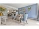 Cozy living room featuring comfortable seating, soft blue walls, and open access to the dining area at 6317 Selborn Sw Dr, Atlanta, GA 30331