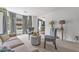 Bright living room featuring neutral walls, plush seating, and large windows with natural light and views at 6317 Selborn Sw Dr, Atlanta, GA 30331