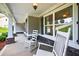 Inviting front porch featuring classic rocking chairs and stone accents for a cozy welcome at 2565 Aaron Ct, Loganville, GA 30052