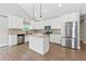 Modern kitchen with white cabinets, granite countertops, and stainless steel appliances at 2565 Aaron Ct, Loganville, GA 30052
