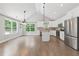 Bright, open kitchen with island, stainless appliances and views of the trees at 2565 Aaron Ct, Loganville, GA 30052
