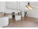 Well-lit kitchen with island, stainless steel appliances, and modern pendant lighting at 2565 Aaron Ct, Loganville, GA 30052