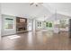 Bright open floor plan with hardwood floors, stone fireplace, and white kitchen island and lots of natural light at 2565 Aaron Ct, Loganville, GA 30052