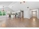 Open-concept living space with vaulted ceilings and hardwood floors, perfect for entertaining at 2565 Aaron Ct, Loganville, GA 30052