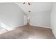 Spacious main bedroom features carpet floors, neutral paint, vaulted ceiling and a view to walk-in closet at 2565 Aaron Ct, Loganville, GA 30052