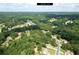 Residential area with houses surrounded by green trees, highlighting the property's proximity to Loganville at 2565 Aaron Ct, Loganville, GA 30052