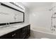 Elegant bathroom with double vanity, marble countertop, and bathtub with shower at 2645 Barkley Manor Dr, Lawrenceville, GA 30044