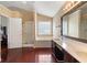 Primary bathroom featuring a large soaking tub, double sinks, and updated vanity at 2645 Barkley Manor Dr, Lawrenceville, GA 30044