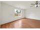 Bright bedroom with a large window and wood floors at 2645 Barkley Manor Dr, Lawrenceville, GA 30044