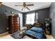Unique Batman themed bedroom with dark grey walls, themed bedding, and decor at 2645 Barkley Manor Dr, Lawrenceville, GA 30044