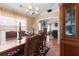 Traditional dining room with an opening to living room featuring tile floors and elegant decor at 2645 Barkley Manor Dr, Lawrenceville, GA 30044