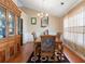 Traditional dining room featuring tile floors, a decorative rug, and a wooden china cabinet at 2645 Barkley Manor Dr, Lawrenceville, GA 30044
