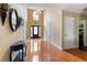 Bright foyer with tile flooring, and decorative lighting with a view to a utility space at 2645 Barkley Manor Dr, Lawrenceville, GA 30044