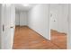 Bright hallway with hardwood floors leading to additional rooms at 2645 Barkley Manor Dr, Lawrenceville, GA 30044