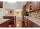 Gourmet kitchen with custom cabinets, granite countertops, and a large stainless refrigerator at 2645 Barkley Manor Dr, Lawrenceville, GA 30044