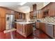 Updated kitchen featuring stainless appliances, a granite island, and custom cabinets at 2645 Barkley Manor Dr, Lawrenceville, GA 30044