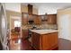 Updated kitchen showcasing custom cabinets, a granite island, and stainless steel appliances at 2645 Barkley Manor Dr, Lawrenceville, GA 30044