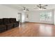 Spacious living room with hardwood floors, ceiling fans, and natural light at 2645 Barkley Manor Dr, Lawrenceville, GA 30044