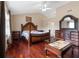 Main bedroom featuring hardwood floors, vaulted ceilings, and stylish traditional furniture at 2645 Barkley Manor Dr, Lawrenceville, GA 30044
