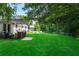Expansive backyard with lush green lawn, patio seating area, and plenty of room for outdoor activities at 3385 Huntington Ct, Douglasville, GA 30134