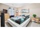 Stylish bedroom featuring a platform bed, modern decor, laminate flooring, and bedside tables at 3385 Huntington Ct, Douglasville, GA 30134