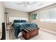 This bedroom features a ceiling fan, wood floors, and a decorative wooden chest at the foot of the bed at 3385 Huntington Ct, Douglasville, GA 30134