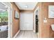 Hallway with laminate floors, a double door closet, and access to an outdoor area at 3385 Huntington Ct, Douglasville, GA 30134