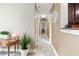 Hallway with laminate flooring, and decorative touches, connecting various rooms in the home at 3385 Huntington Ct, Douglasville, GA 30134