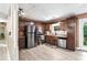 Updated kitchen with stainless steel appliances, wooden cabinetry, and bright laminate flooring at 3385 Huntington Ct, Douglasville, GA 30134