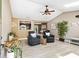 Inviting living room featuring vaulted ceilings, skylights, fan and a cozy seating arrangement at 3385 Huntington Ct, Douglasville, GA 30134