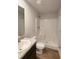 Well-lit bathroom features a modern vanity with granite countertop and a walk-in shower at 89 Cowpen Ct, Covington, GA 30014