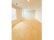 Large bedroom with carpet flooring, two windows, and neutral paint at 89 Cowpen Ct, Covington, GA 30014