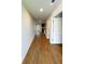 Bright hallway with beautiful wood flooring, neutral walls, and access to the kitchen at 89 Cowpen Ct, Covington, GA 30014