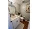 Bathroom featuring a modern vanity, a round mirror, and a decorative window shelf at 1044 Mariners Ct, Stone Mountain, GA 30083