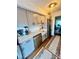 Modern kitchen with stainless steel appliances, white cabinets, and a farmhouse sink at 1044 Mariners Ct, Stone Mountain, GA 30083
