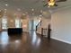 Expansive living room with hardwood floors and plenty of space for entertaining at 163 Basil St, Cumming, GA 30040