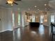 Open-concept floor plan showcases hardwood floors, recessed lighting, and a modern kitchen at 163 Basil St, Cumming, GA 30040