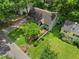 Aerial view of the single Gathering home showcasing its well-maintained lawn, landscaping, and curb appeal at 2259 Eastway Rd, Decatur, GA 30033