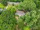 Aerial view of the property surrounded by lush greenery, offering privacy and a serene setting in a residential neighborhood at 2259 Eastway Rd, Decatur, GA 30033