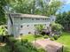 Backyard view featuring a deck, stone patio and landscaped yard showcasing outdoor living and entertaining at 2259 Eastway Rd, Decatur, GA 30033